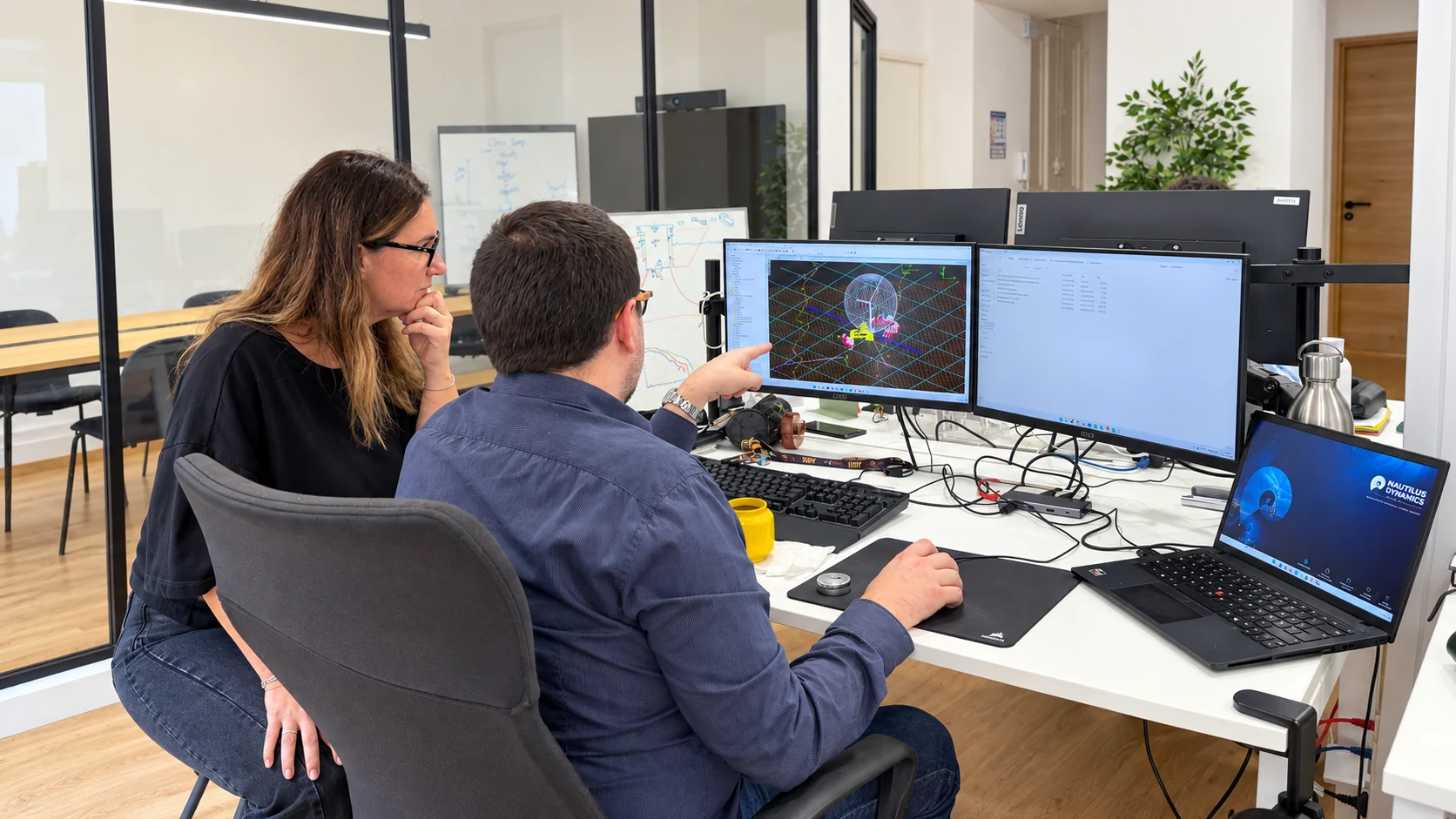 Nautilus Dynamics colleagues reviewing a numerical model together